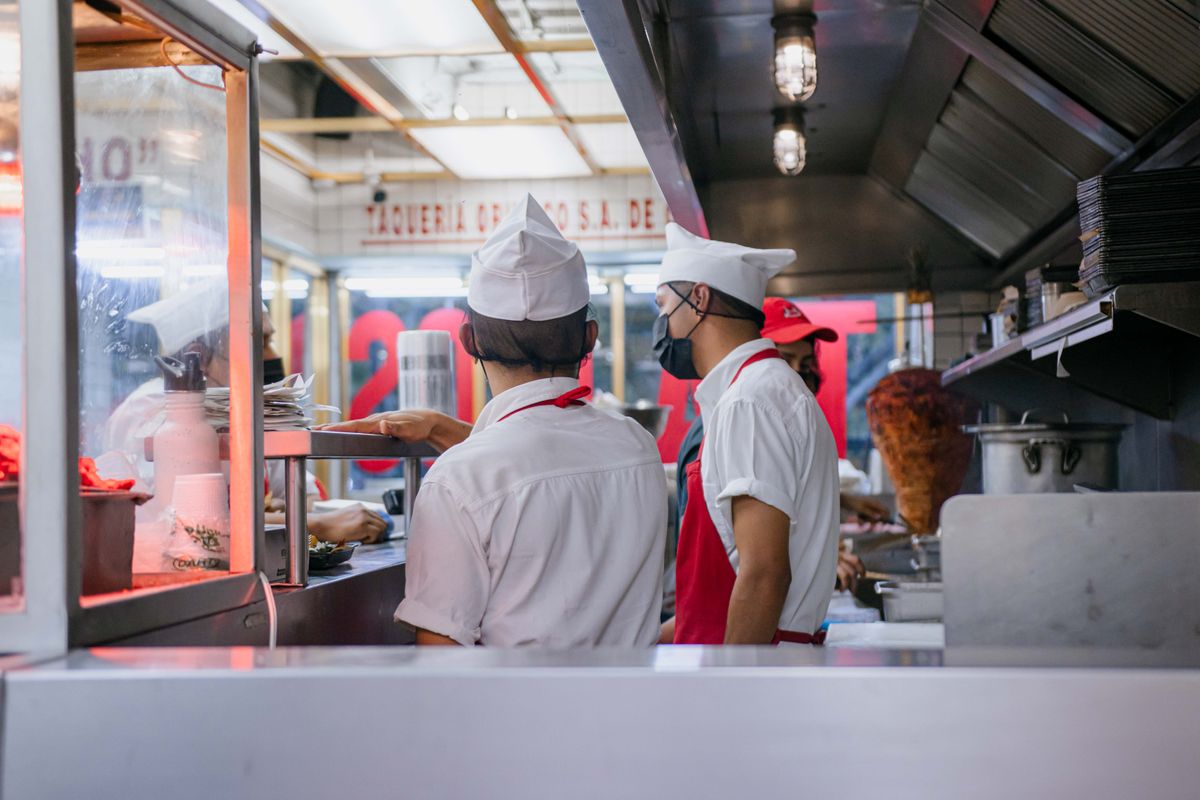 Chefs working in a Latin restaurant kitchen